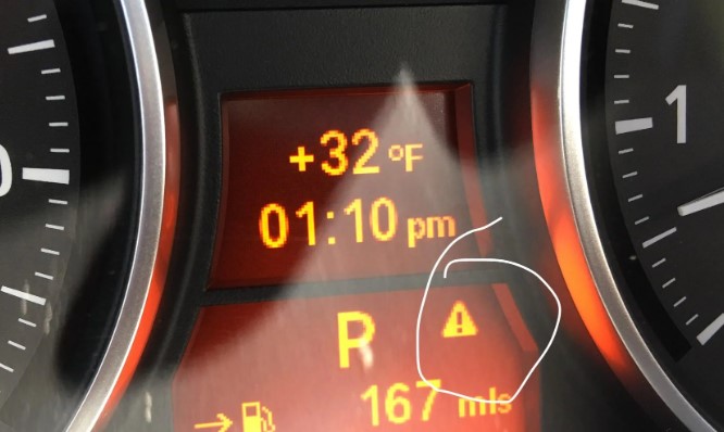 Deciphering the Orange Triangle Sign on the Dashboard